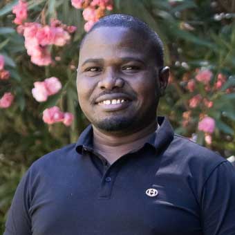 Portrait photo of John Saruni