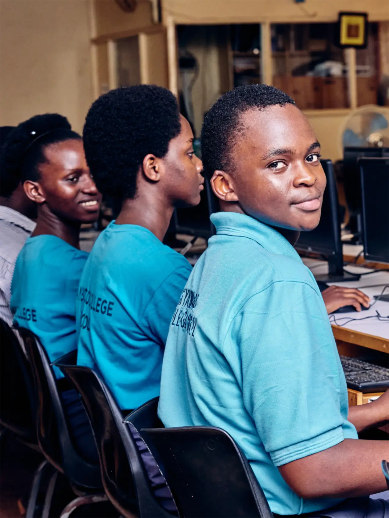 Students work on computers in a classroom