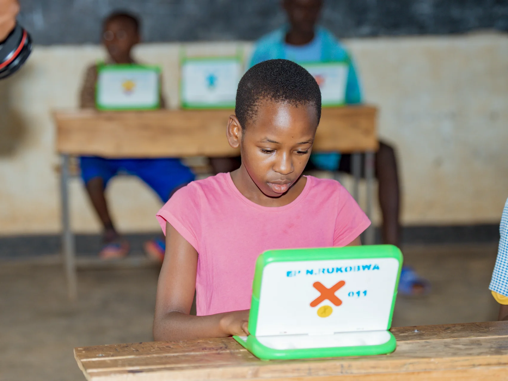 A student works on a OLPC laptop A student works on a OLPC laptop