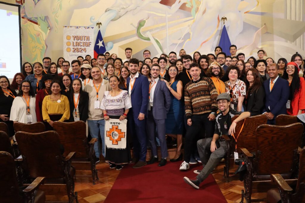 A huge group of young event participants pausing for a group photo