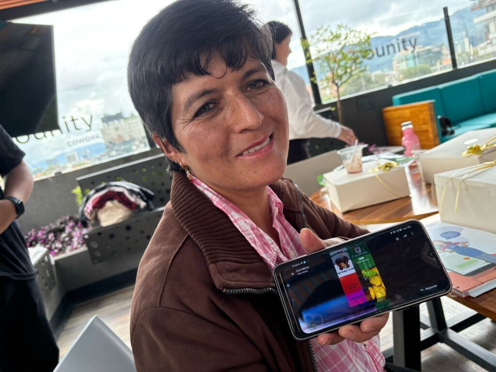 Smiling middle aged woman showcasing an image on the phone