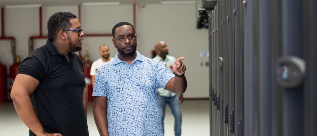 two men talking at a data center