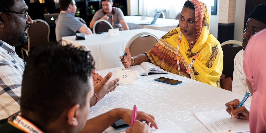 people collaborating around a table in a conference room