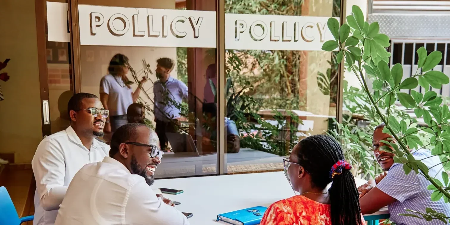 The Pollicy team working around a meeting table