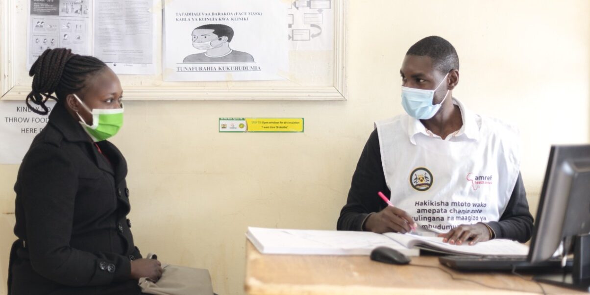 A medical professional meets a patient