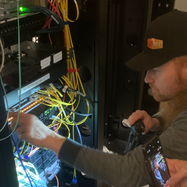 A man is connecting Internet cables.