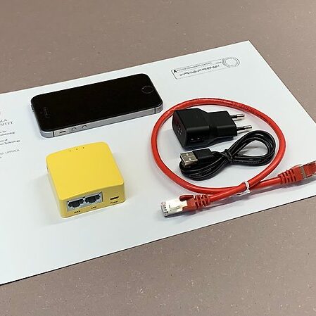 Image of a mobile phone and cables.