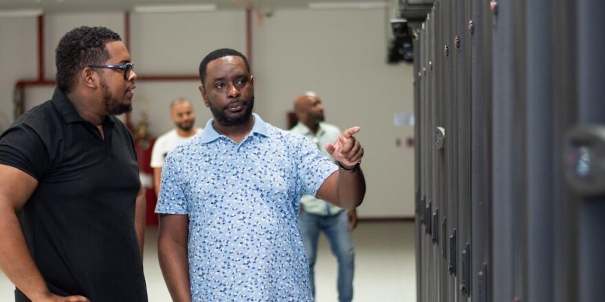 two men talking at a data center