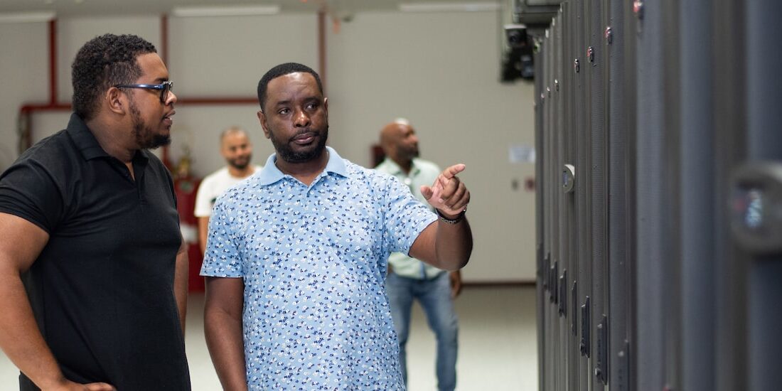 two men talking at a data center